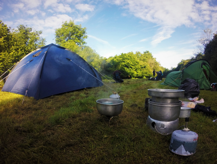 Blue camping tent and cooking equipment