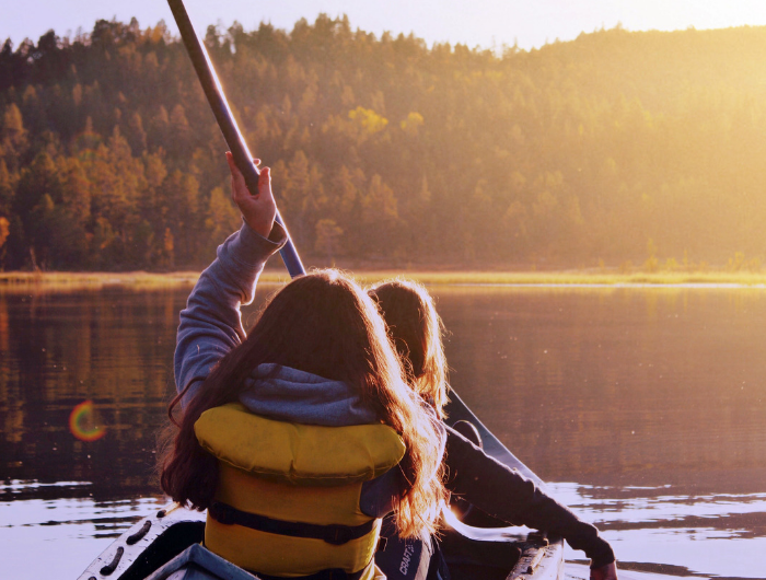 Two people in a canoe on a lake