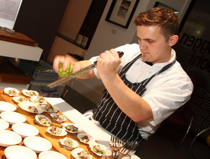 Young chef Jon preparing food