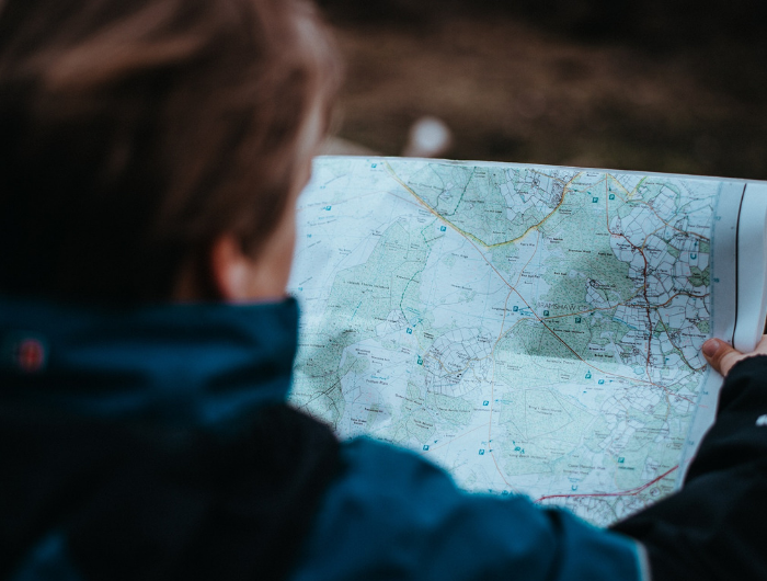 Young person holding a map