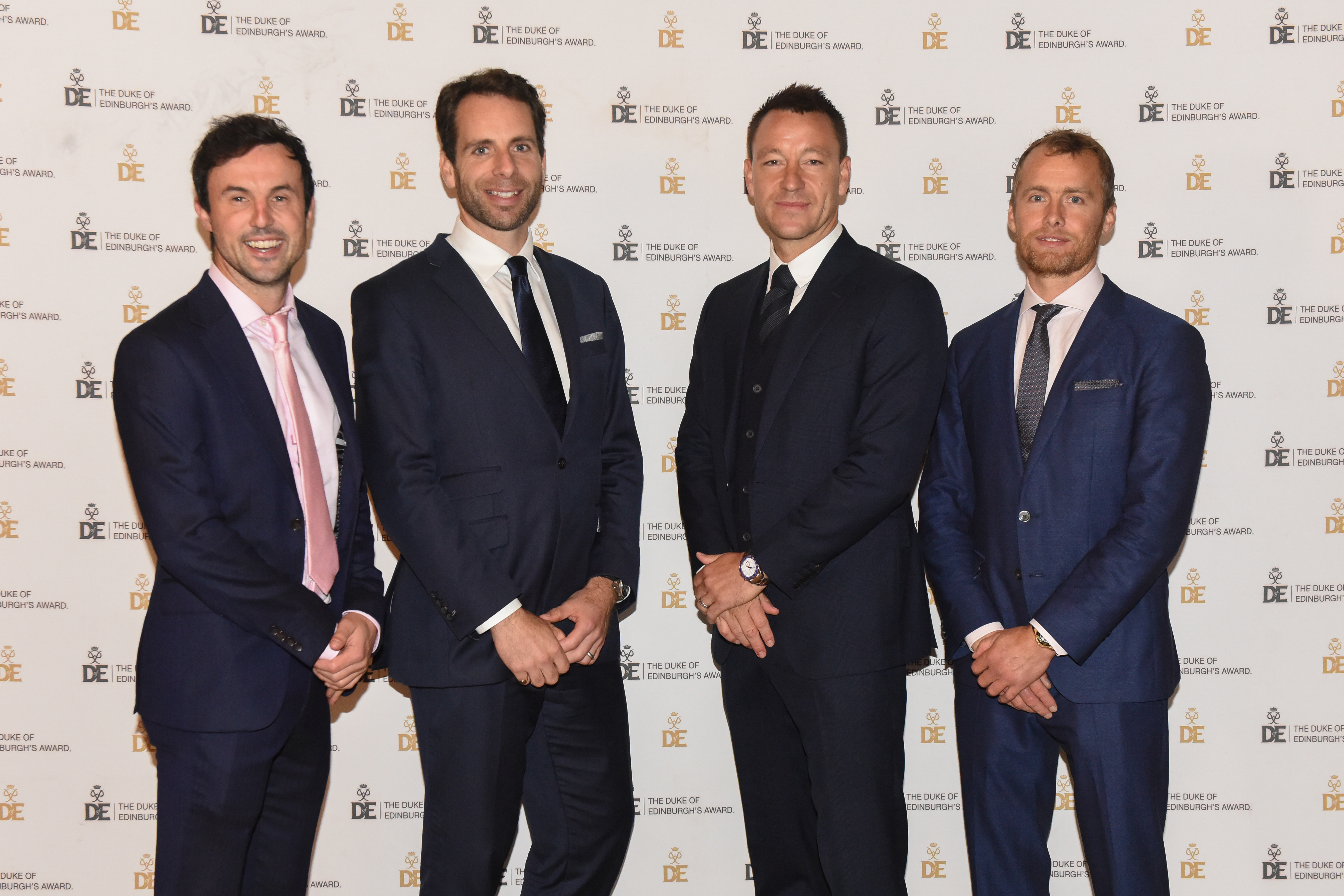 Group photograph at Gold Award Presentation of four male presenters