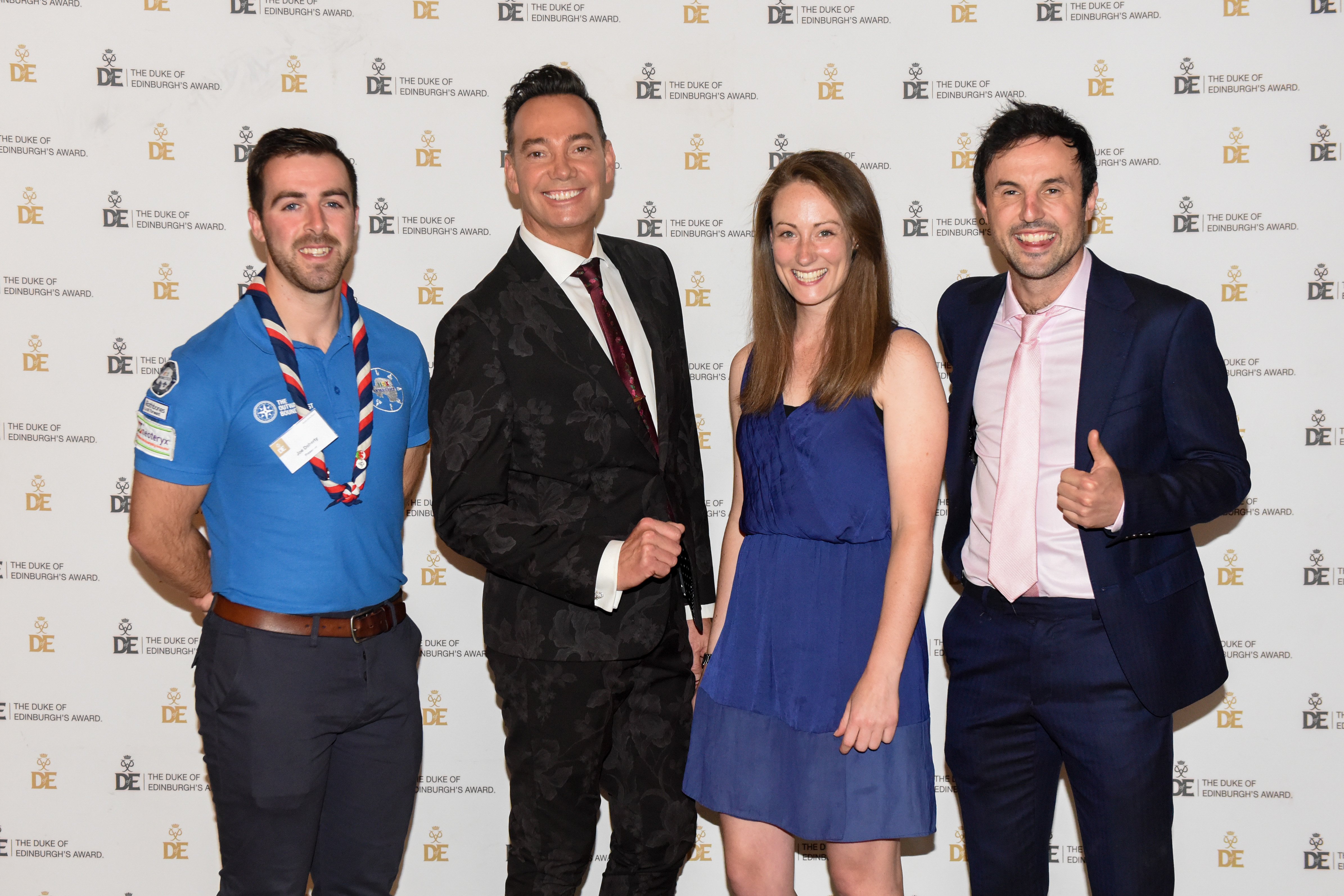 Group photograph at Gold Award Presentation of three male and one female presenters
