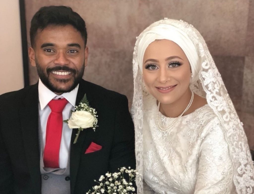 Naeema and Mo at their wedding in formal attire