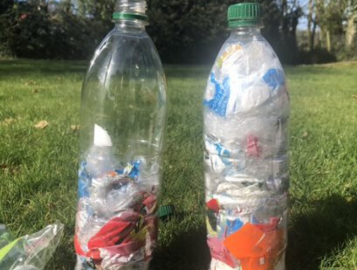 Two plastic bottle with wrappers in