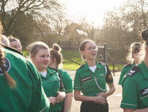 Several young SJA volunteers in uniform