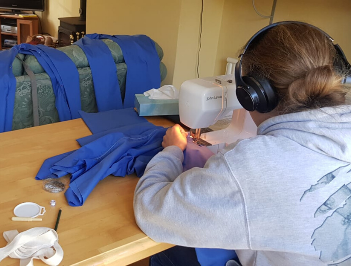 Girl with sewing machine