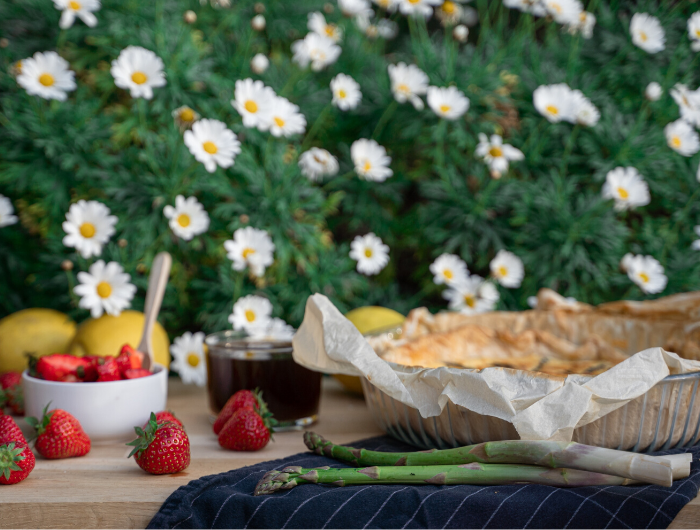 Table laid with food and daisy flowers