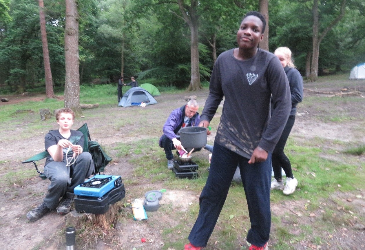 Brent Knoll group shot at a campsite