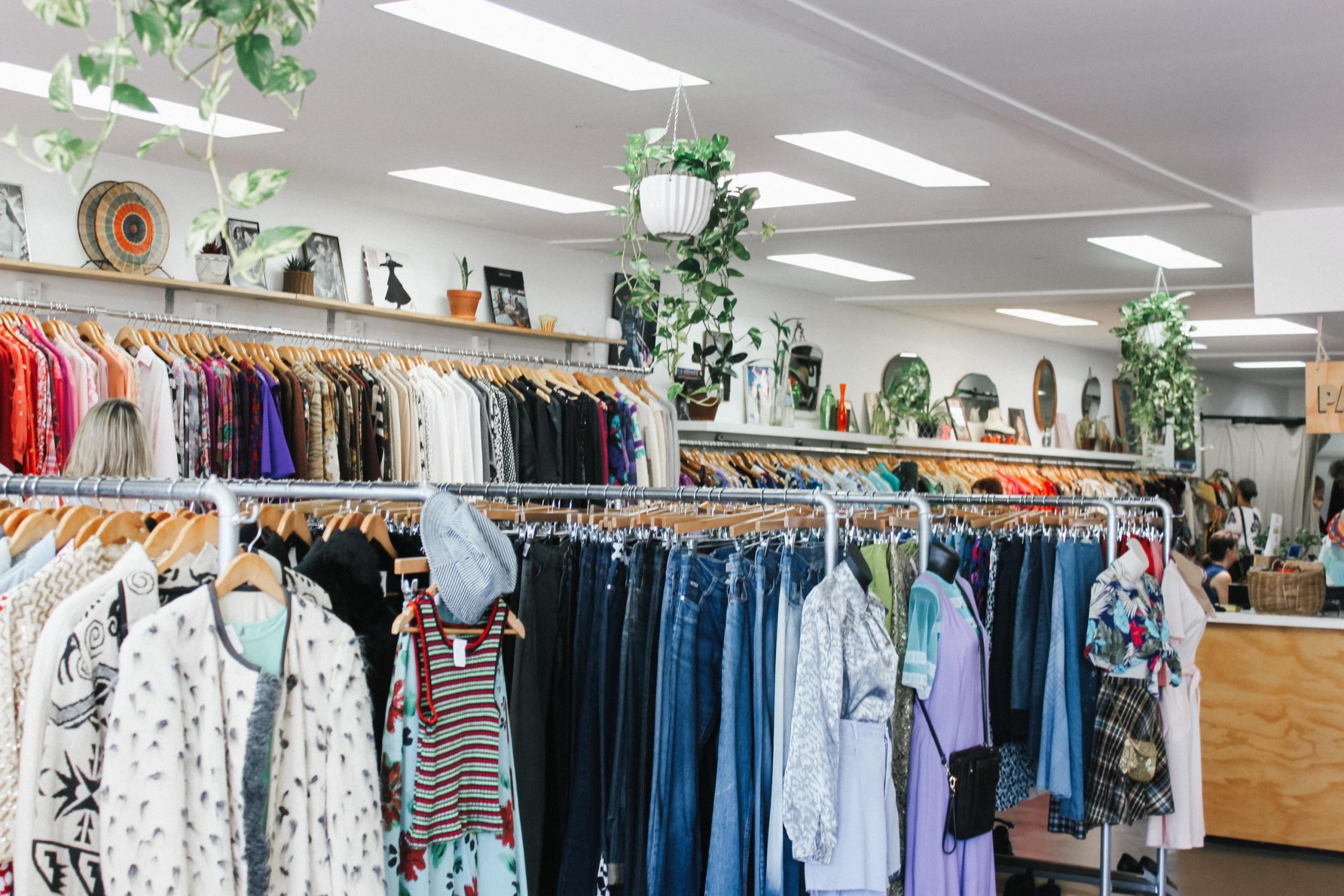 Interior of a charity shop with clothes rails