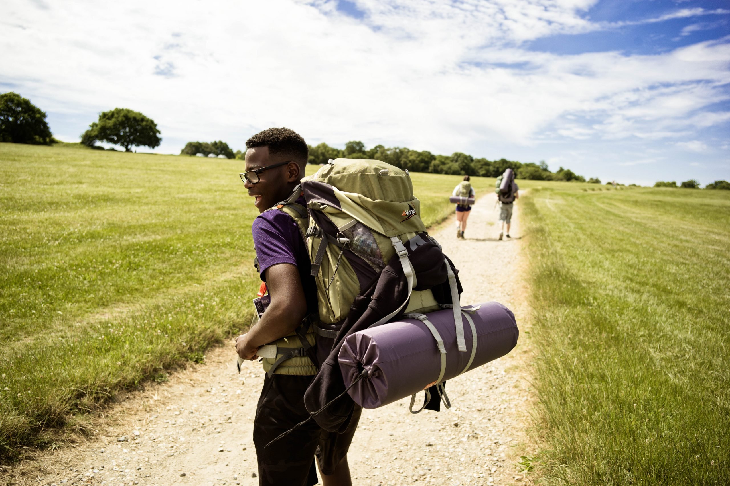 Young man on expedition wearing backpack