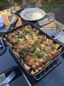 Homemade nachos in a black pan