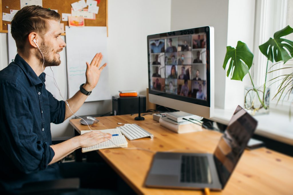 DofE Leader sitting at desk on video chat