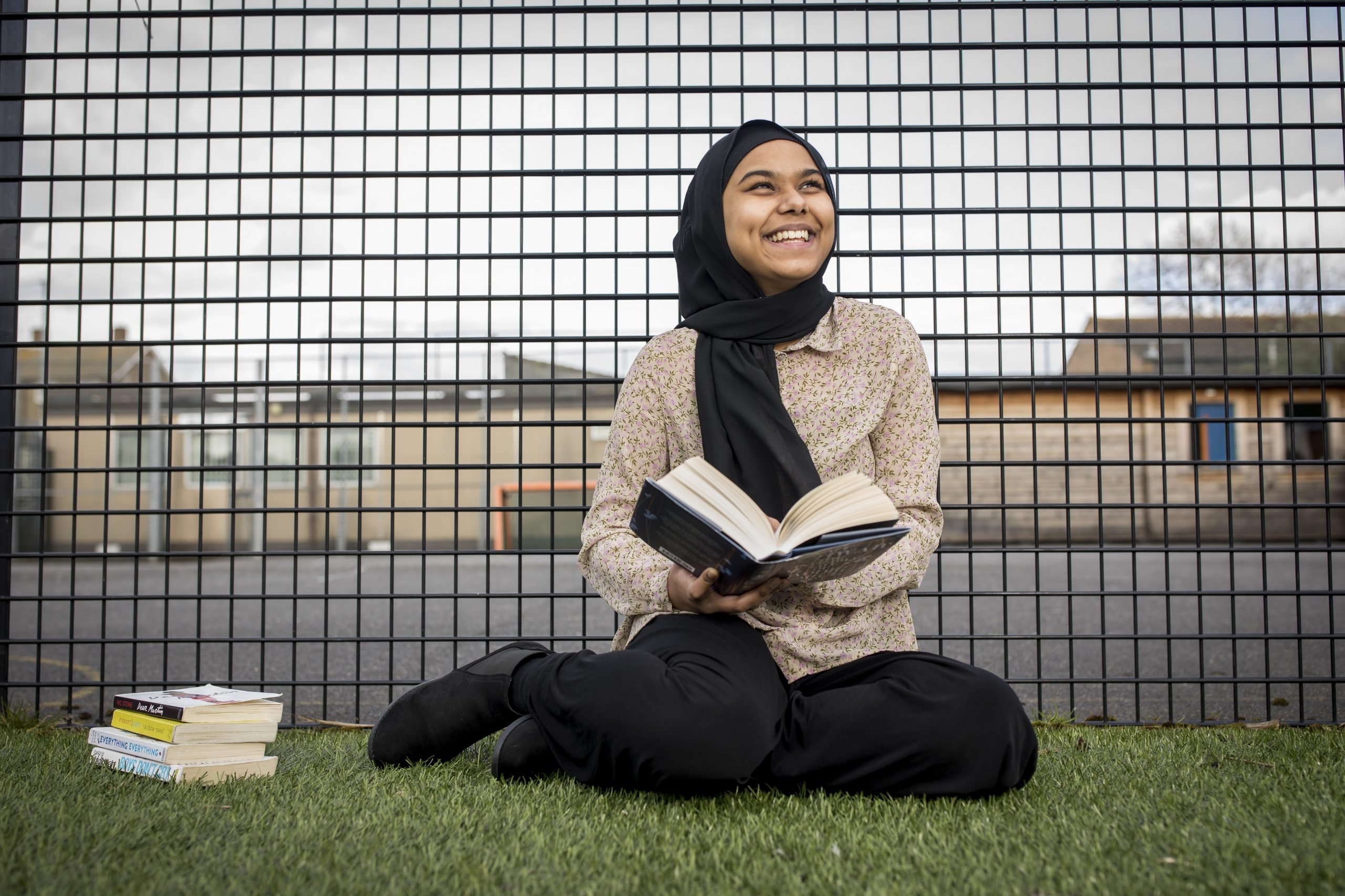 Young female participant reading book