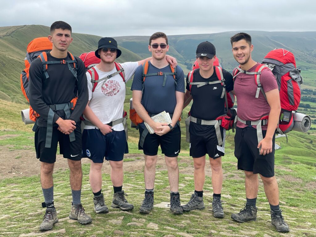 Group of participants on expedition wearing backpacks