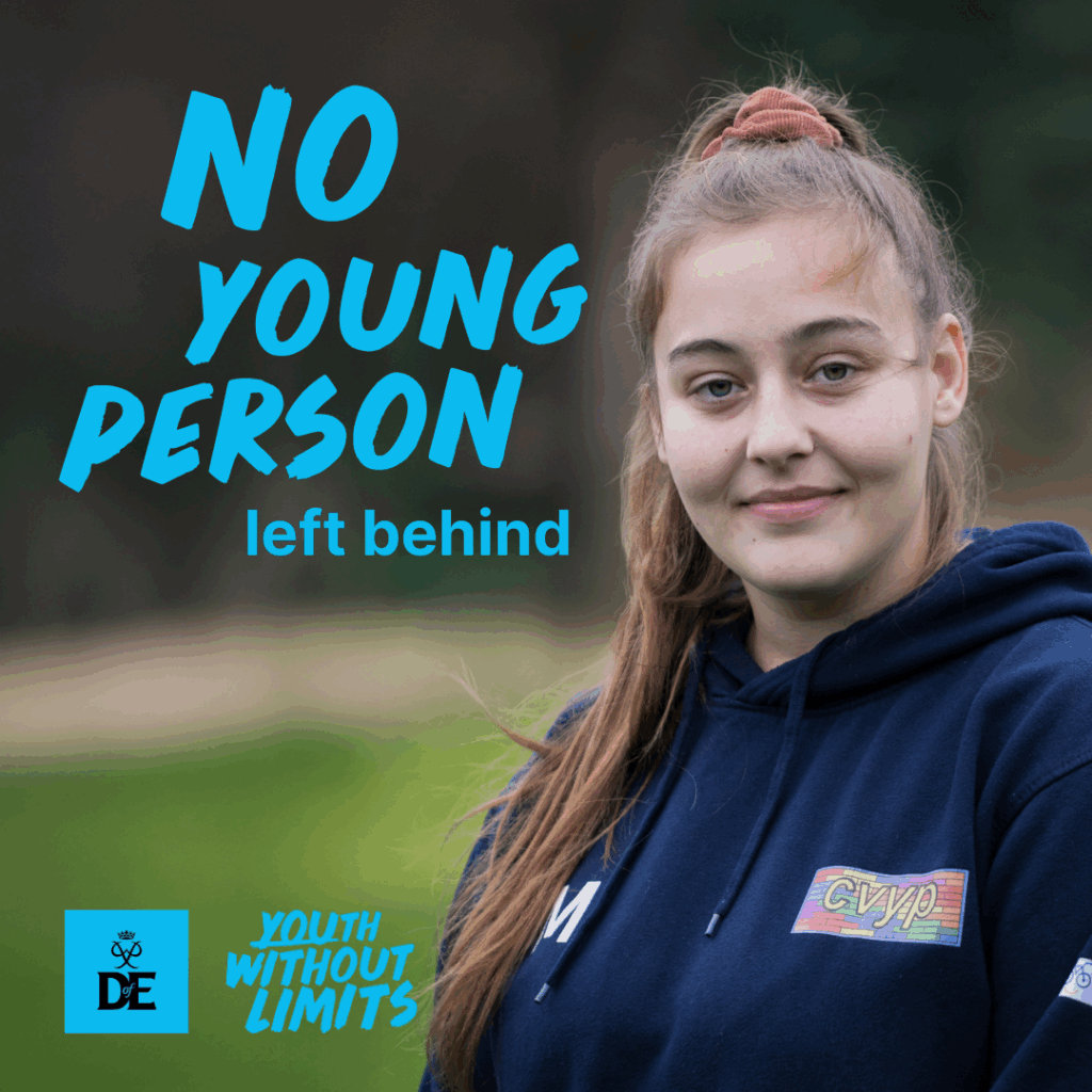 Sophie is smiling slightly and wearing a navy blue hoodie with a rainbow "CVYP" logo. She stands outdoors in a grassy area. Bold turquoise text on the image reads, "No young person left behind." At the bottom, there are the DofE logo and the phrase "Youth Without Limits."