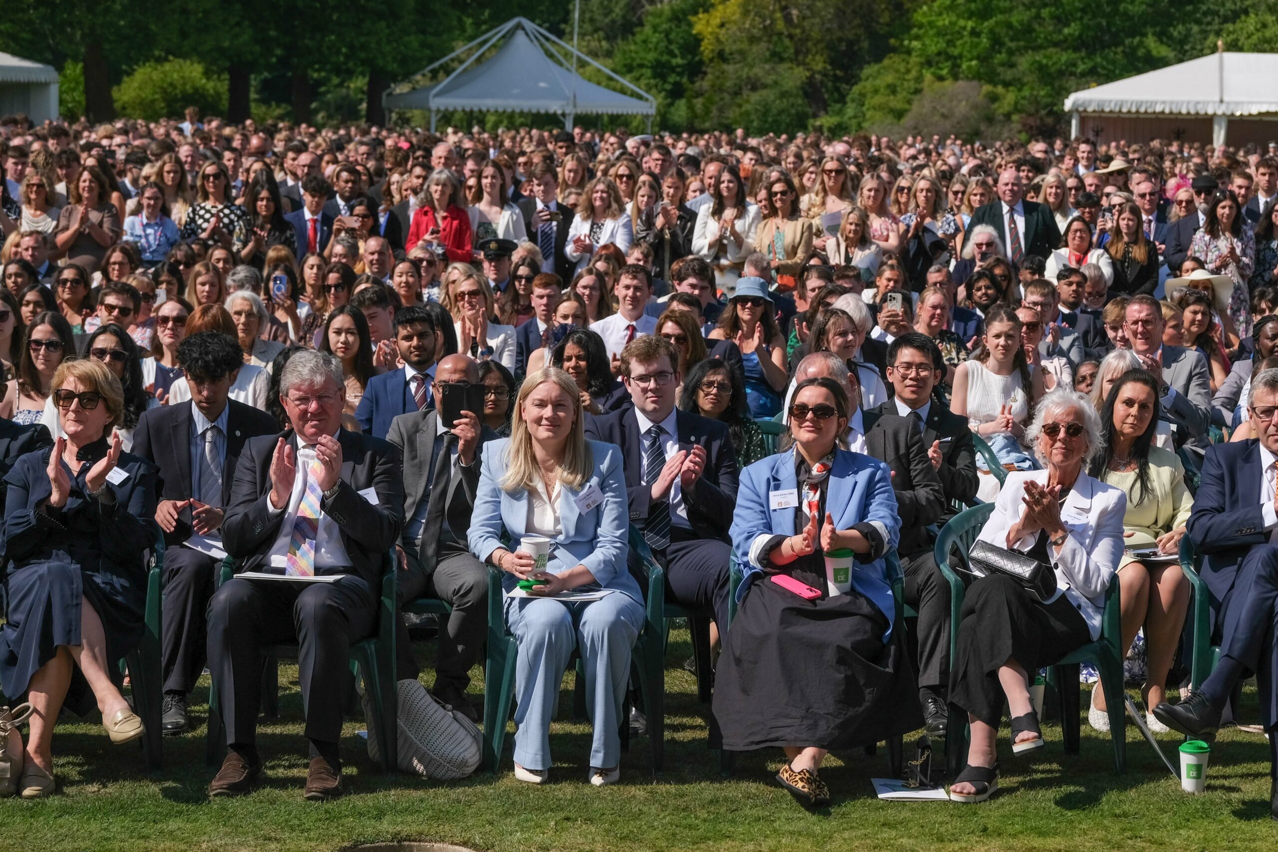 Guests and Award holders listen to speeches in the Buckingham Palace Garden. Credit Ian Smithers.