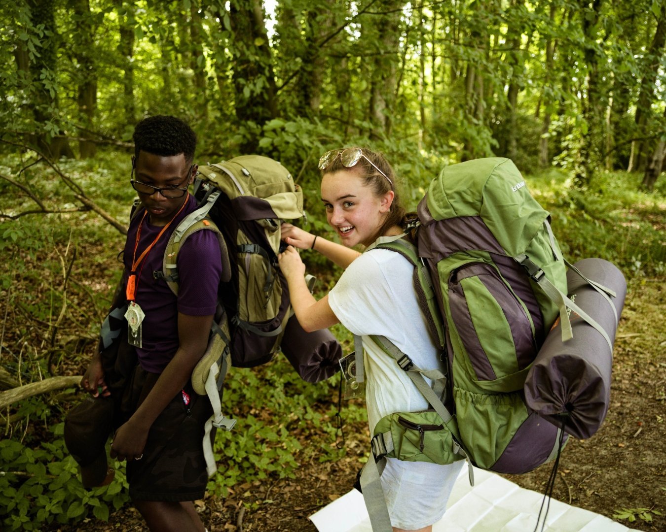 Young people in the woods on expedition