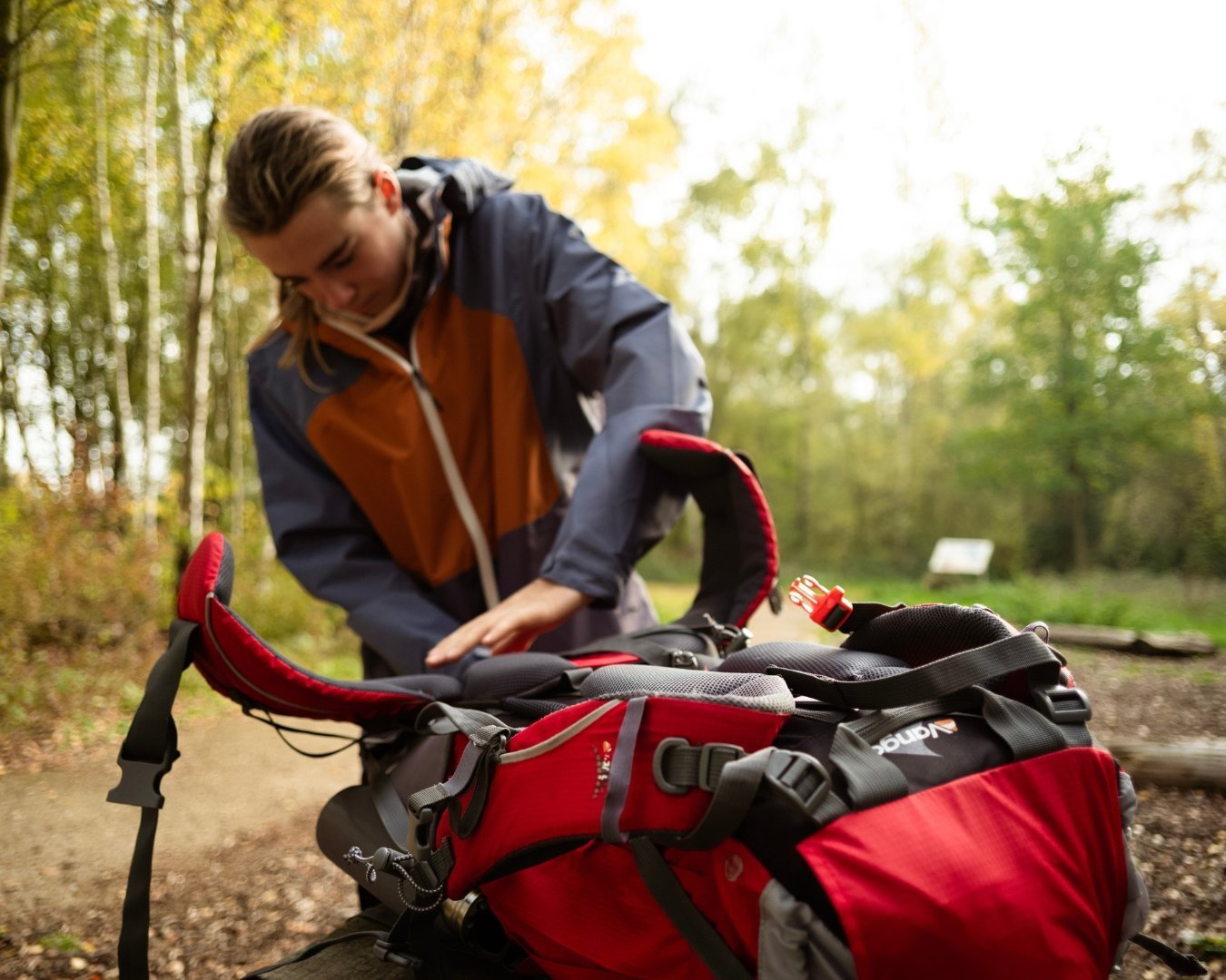 Young person adjusting their rucksack straps