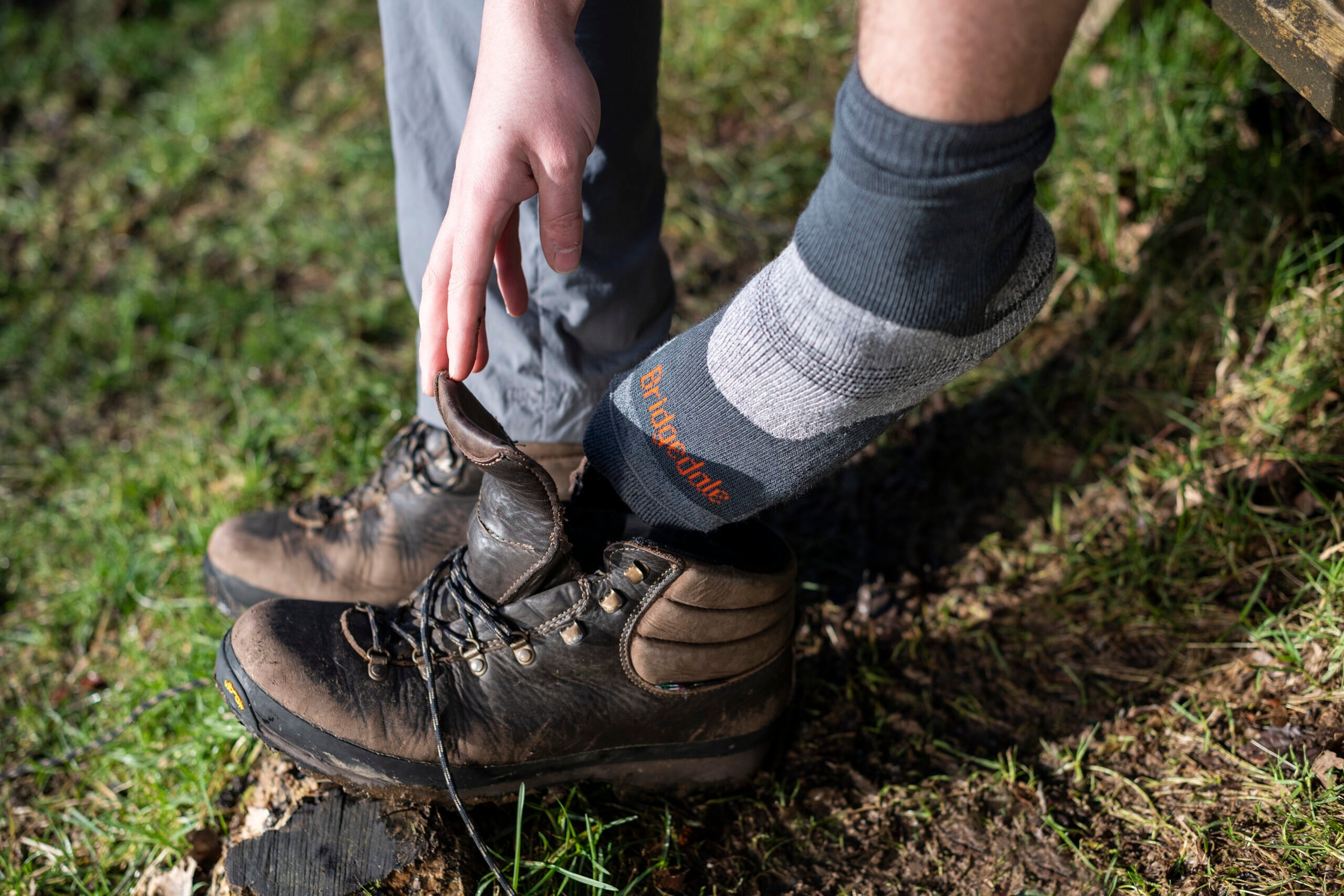 Bridgedale socks shown coming out of walking boots