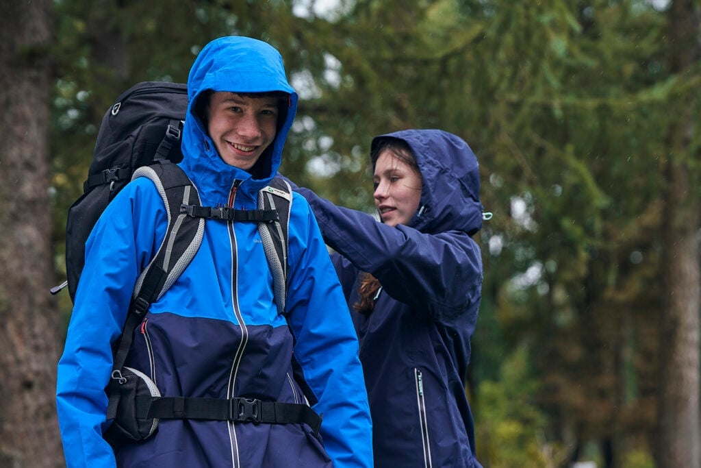 Young person on expedition, dressed in waterproof clothing 