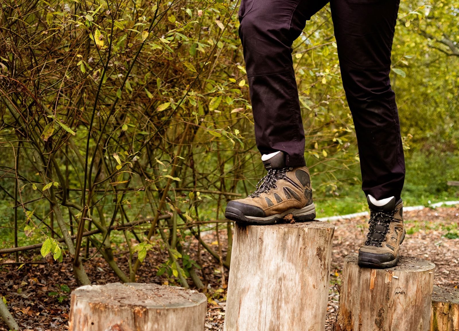 Hi-Tec boots walking over tree stumps