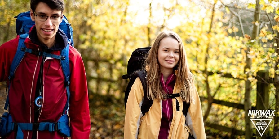Two young people wearing waterproof jackets