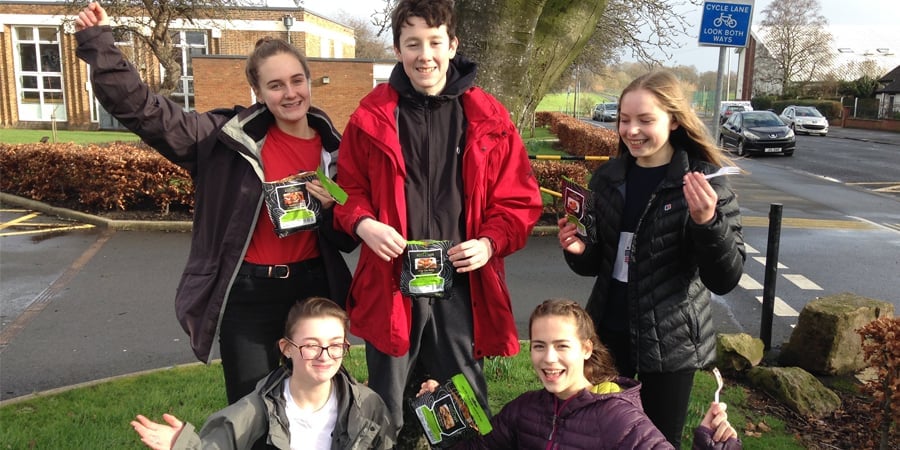 Group of young people holding Wayfayerer food