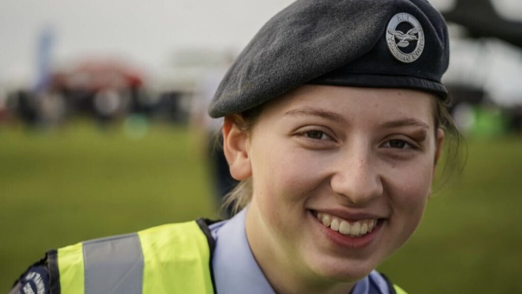 Alexa is smiling and wearing an RAF beret.