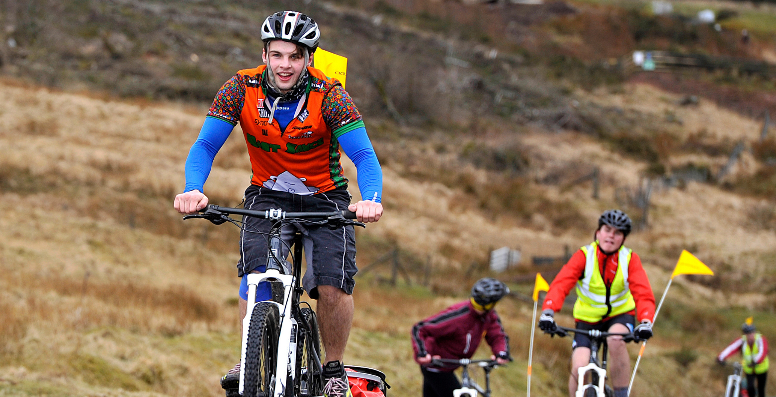 Expeditioners on mountain bikes.