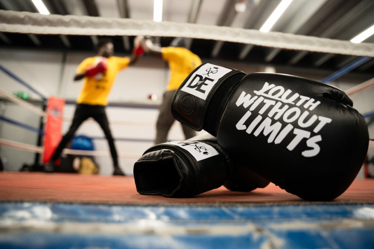 Alt text: A pair of black boxing gloves with the text 