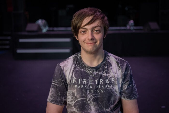 Lewis smiling at the camera.