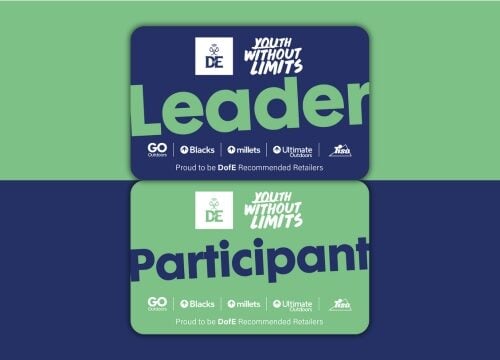 Two DofE Youth Without Limits cards displayed on a split green and navy background. The top card is dark blue with the word “Leader” in large green text, featuring the DofE logo and retailer logos (GO Outdoors, Blacks, Millets, Ultimate Outdoors, Tiso) along with the phrase “Proud to be DofE Recommended Retailers.” The bottom card is green with the word “Participant” in large navy text, also showing the same logos and tagline.