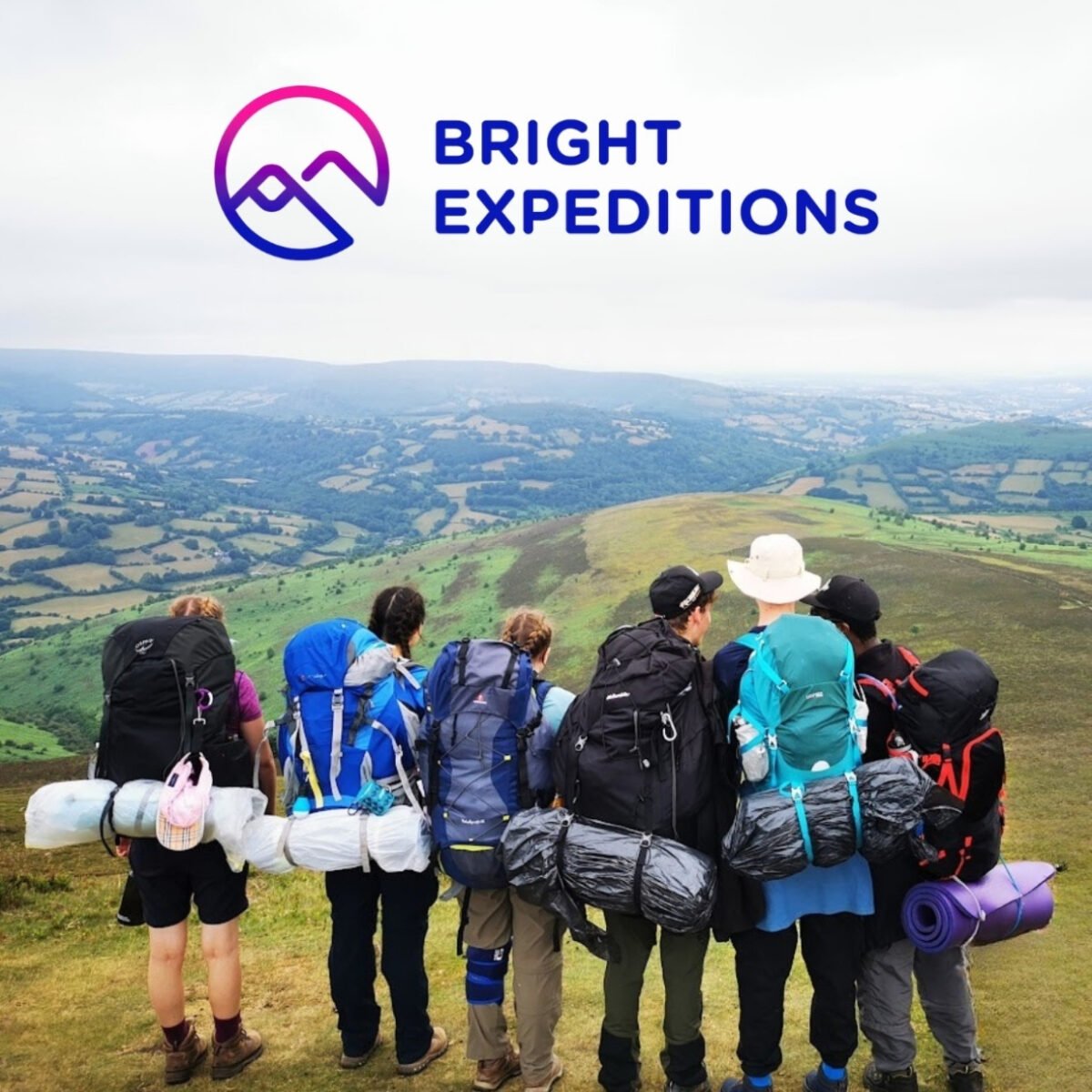 Group of young people on an expedition admiring a landscape view. Blue and pink logo for 