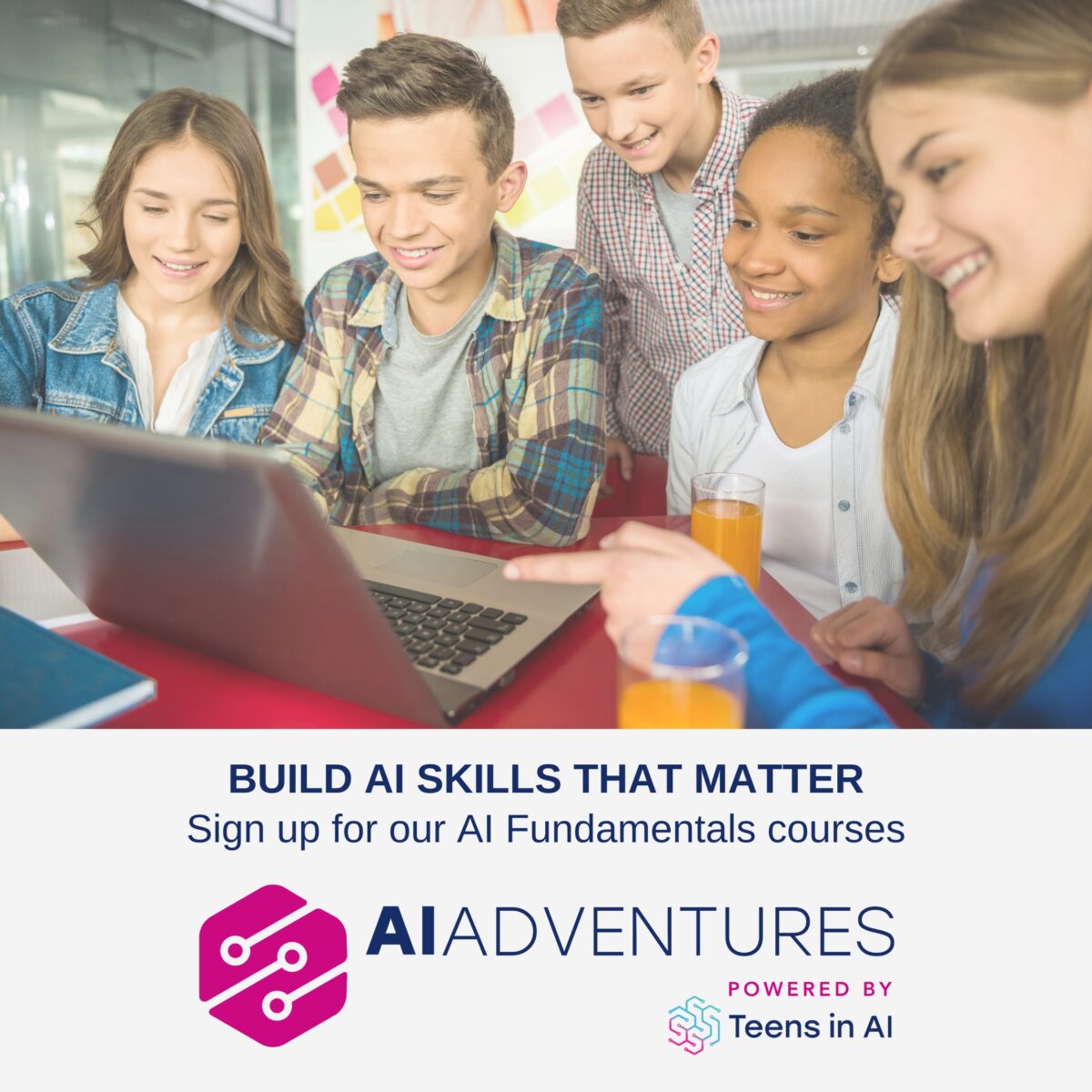 A group of young people looking at a laptop and smiling. Text says 