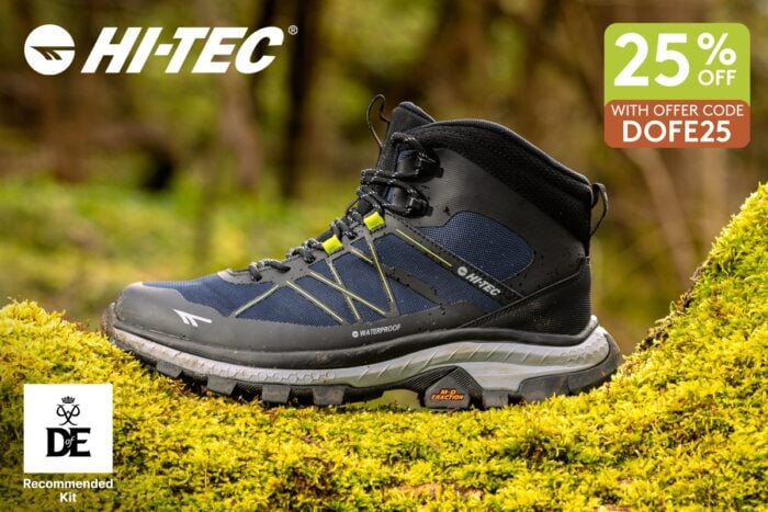 Hi‑Tec waterproof hiking boot resting on moss in a woodland setting, with 25% off offer and Duke of Edinburgh’s Award Recommended Kit badge