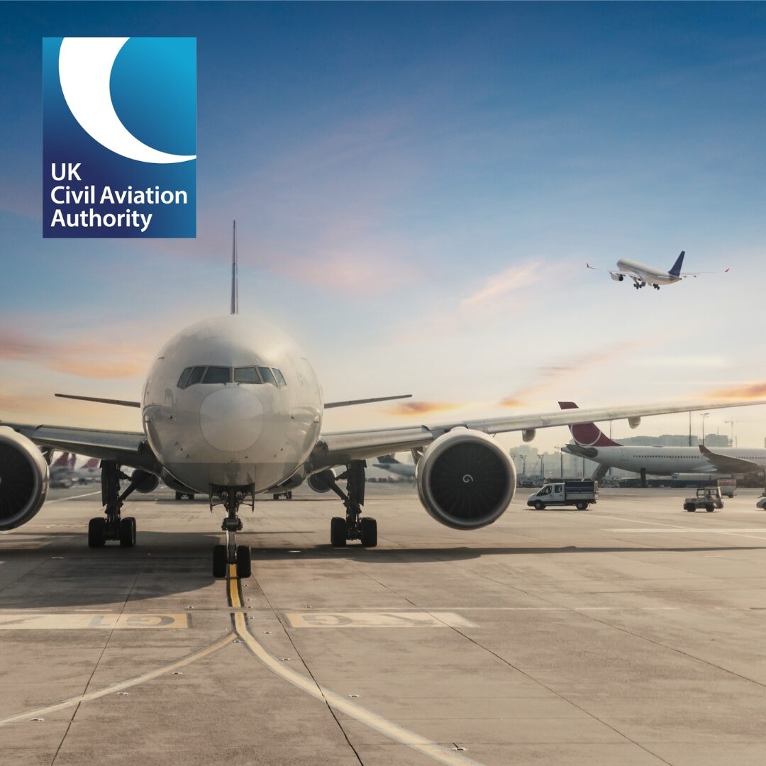 UK Civil Aviation Authority aircraft on runway with planes landing and taking off.