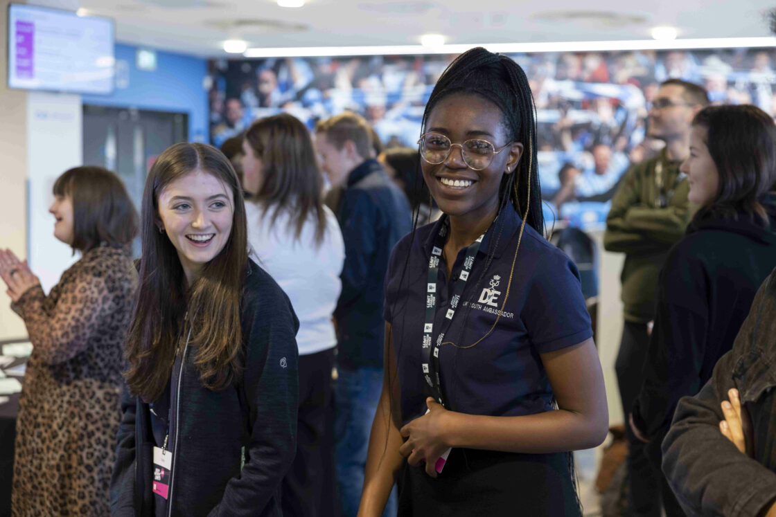 Two young people smiling at Youth Without Limits Live.