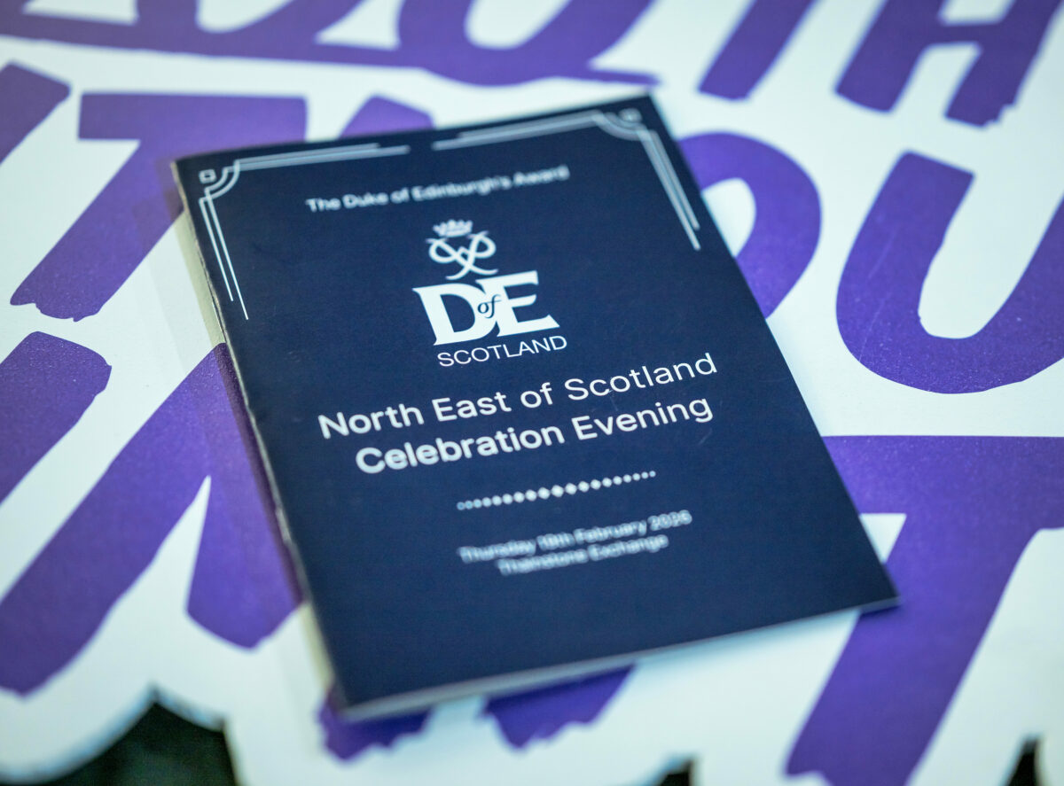 A Duke of Edinburgh’s Award Scotland programme for the North East of Scotland Celebration Evening. The programme cover has the DofE Scotland logo and event details.