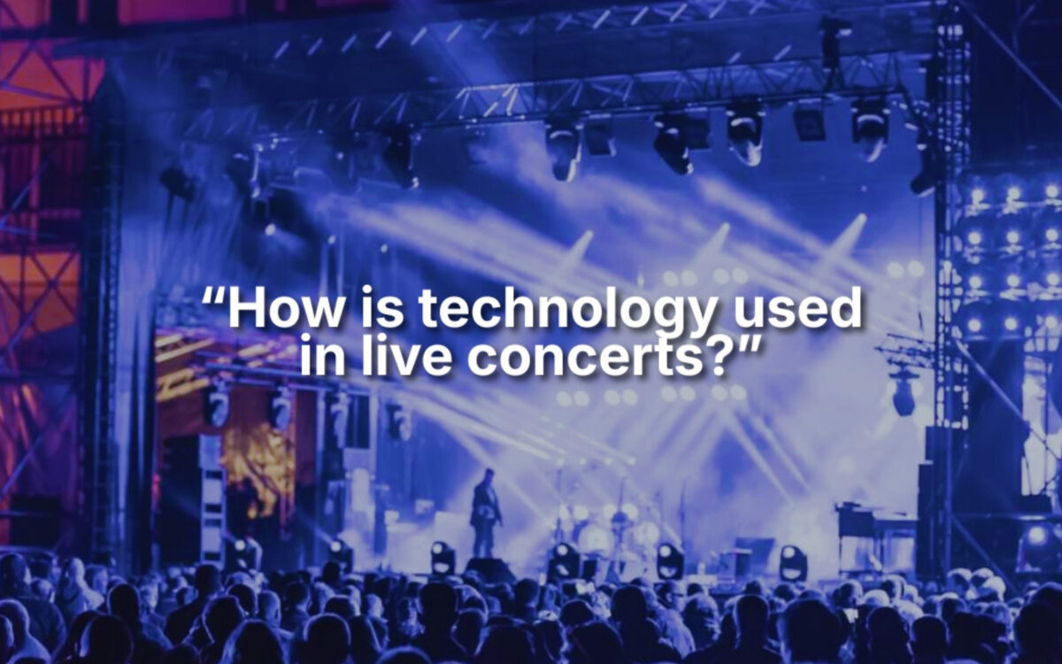 Promotional image for an IBM SkillsBuild microlearning taster titled “How is technology used in live concerts?”. The image shows a large outdoor concert stage illuminated with bright blue and purple lighting effects, spotlights and stage rigging. Silhouettes of performers and equipment can be seen on stage, while a crowd of audience members watches from the foreground. Overlaid text reads: “How is technology used in live concerts?”. The image highlights the role of technology in live events, including lighting, sound, stage production and audience experiences.