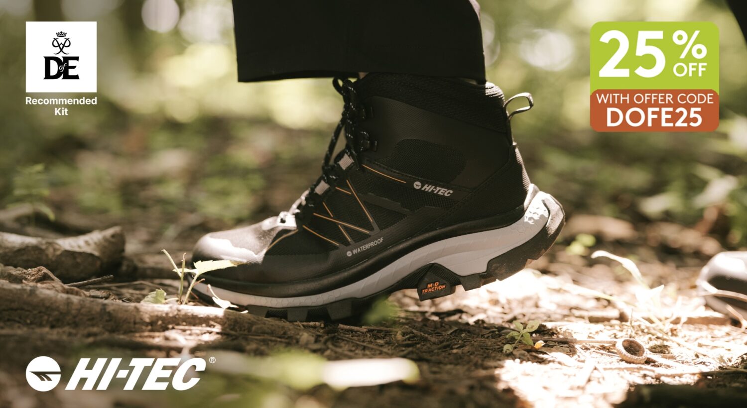 Close-up of a black Hi-Tec waterproof hiking boot on a woodland trail, with sunlight filtering through the trees and illuminating the forest floor. The image includes a Duke of Edinburgh’s Award Recommended Kit badge in the top left corner, a promotional offer in the top right reading “25% OFF with offer code DOFE25”, and the Hi-Tec logo in the bottom left corner.
