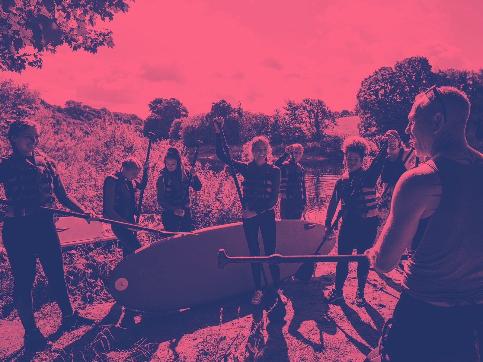 Leader with group paddleboarding