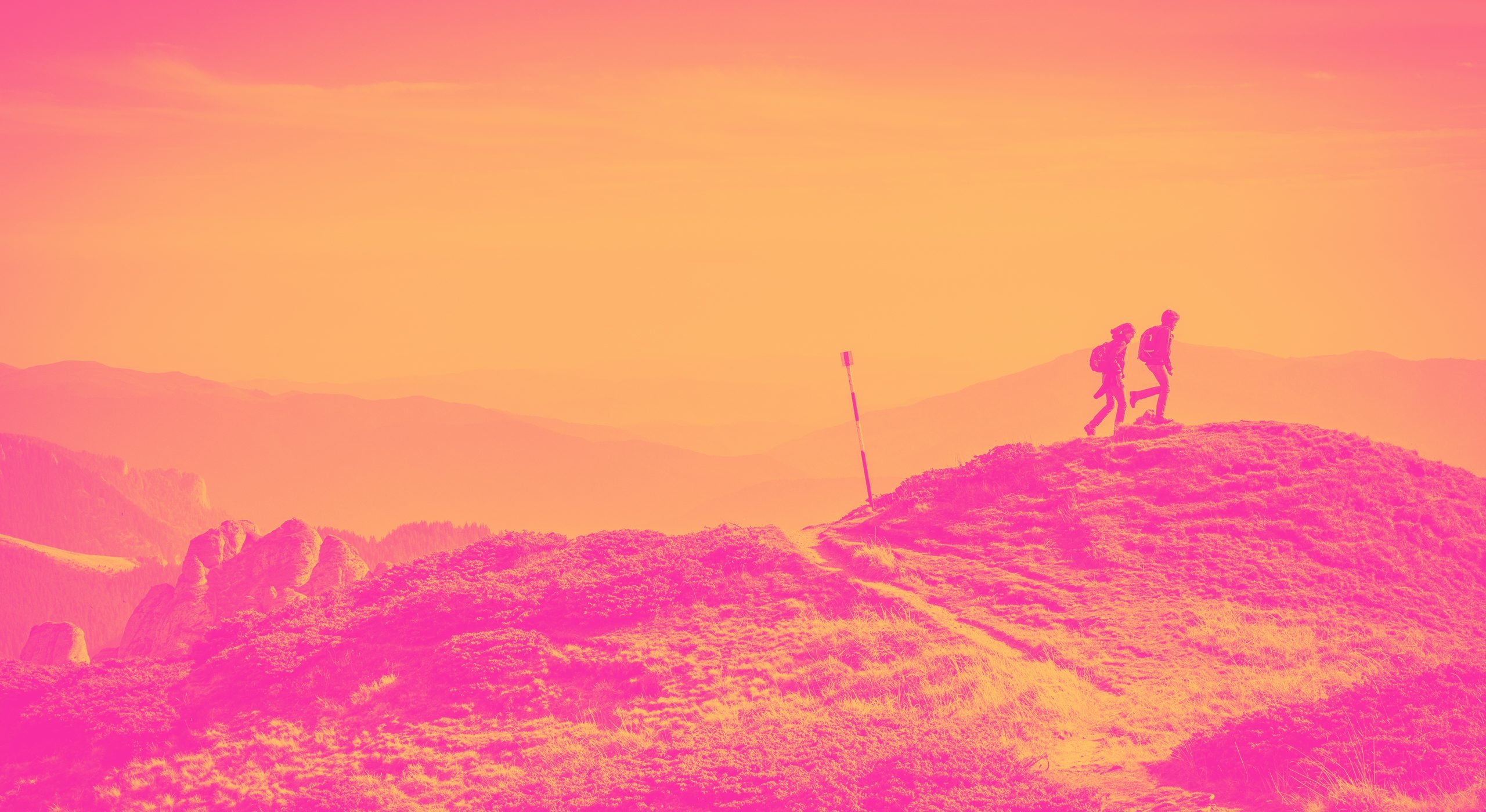 Two hikers on a hill