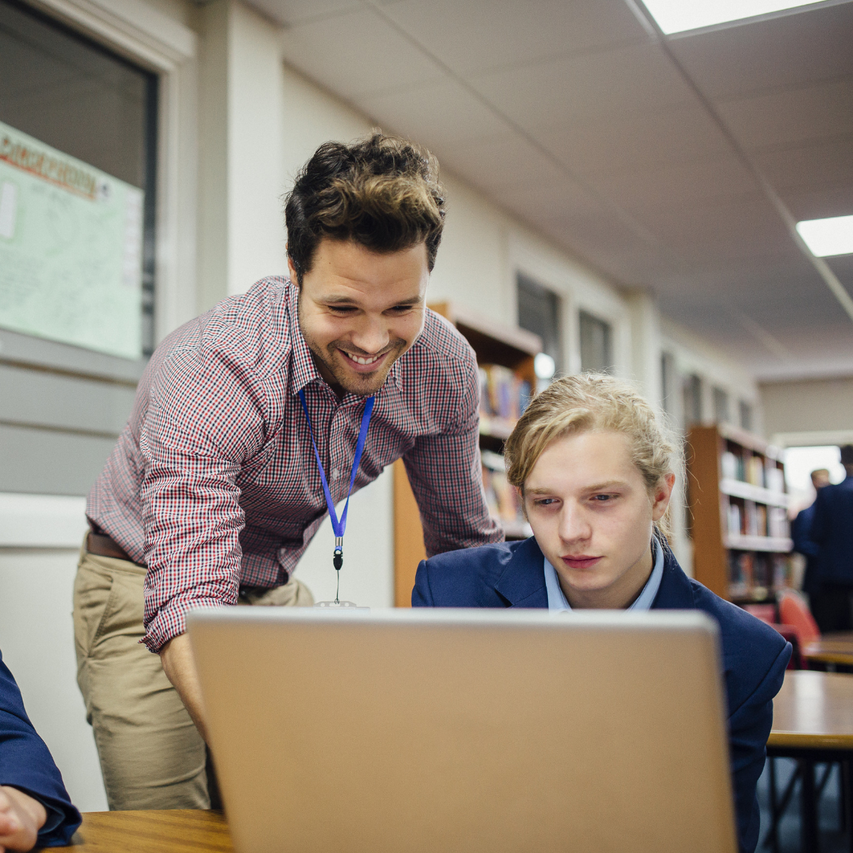 Leader with participant on laptop