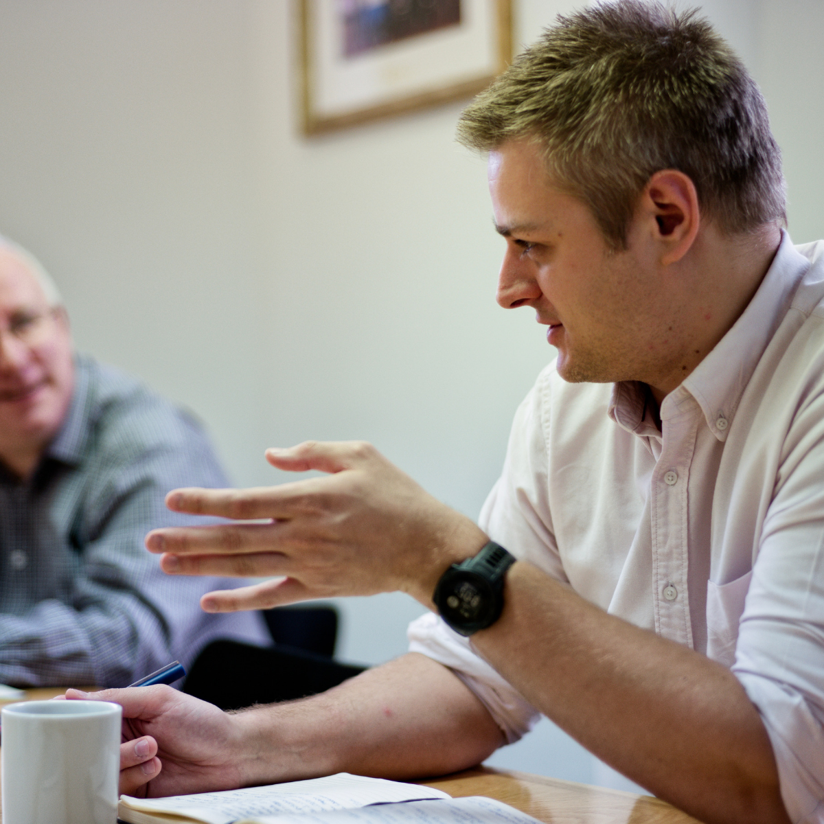 Man from The Duke of Edinburgh's Awards National Operating Authorities Team sat presenting in a meeting