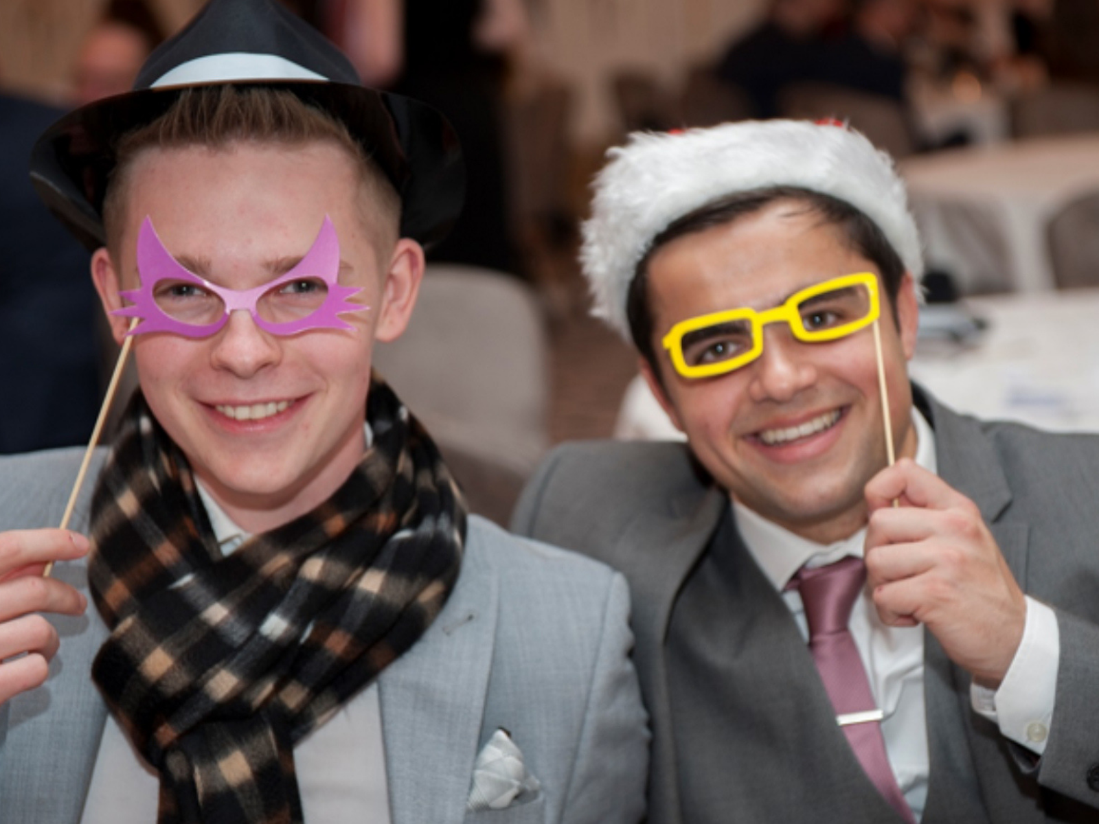 Two male DFS apprentices at Christmas party with masks