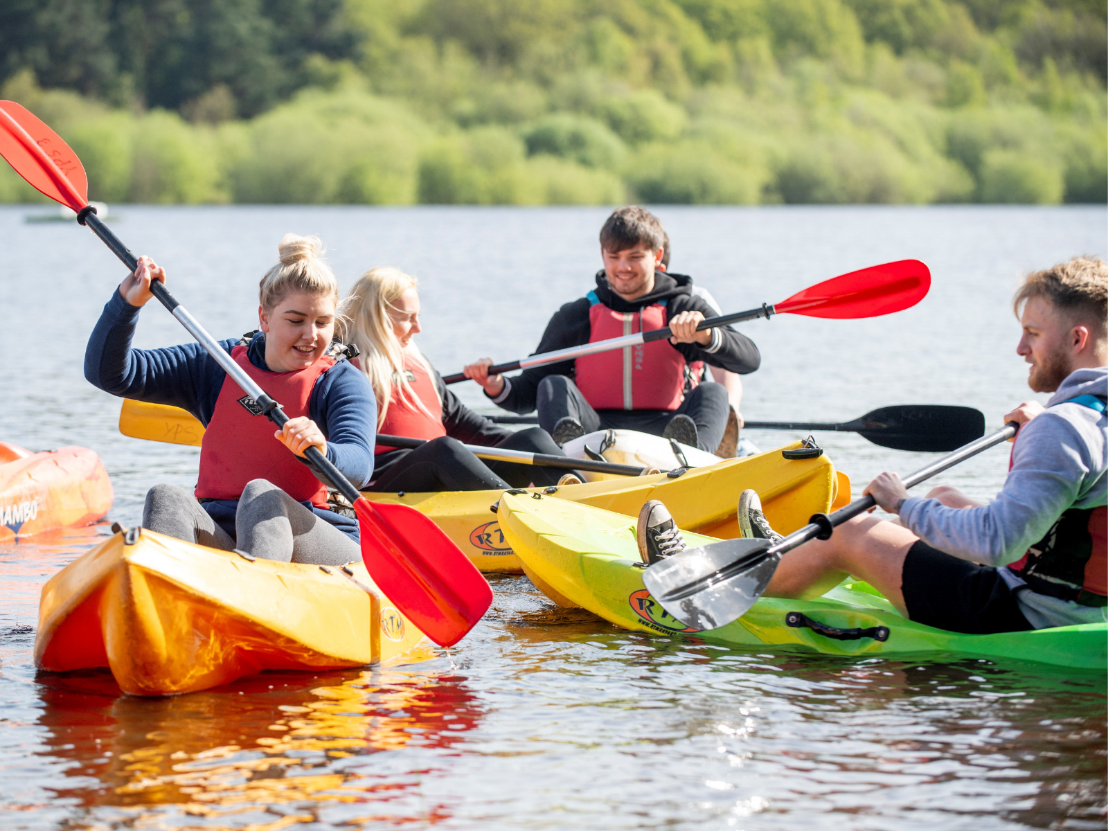 Group of Tarmac apprentices on expedition in canoes