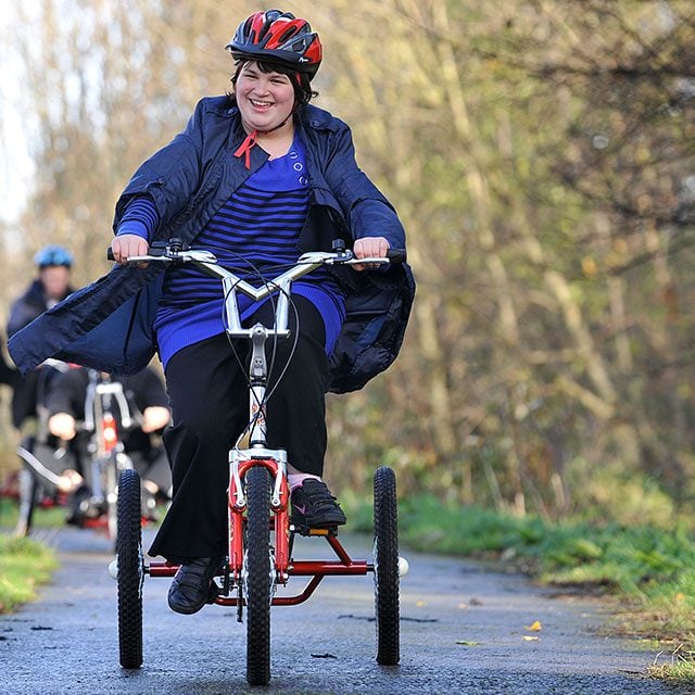 A young woman on tricyle