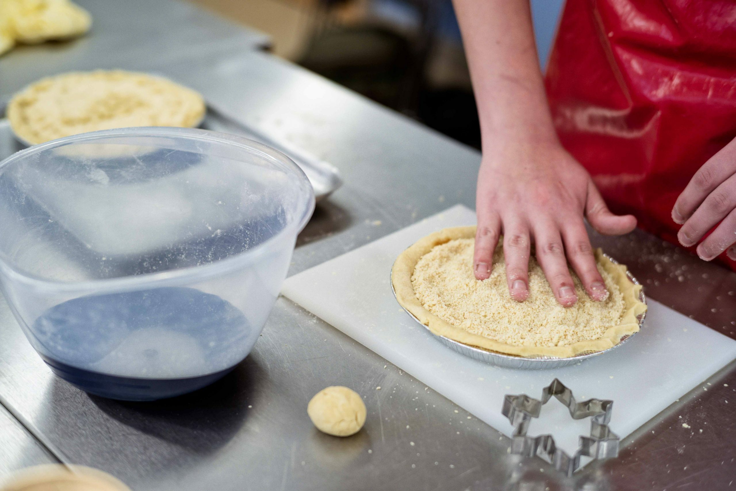 Close up of person making pie crust