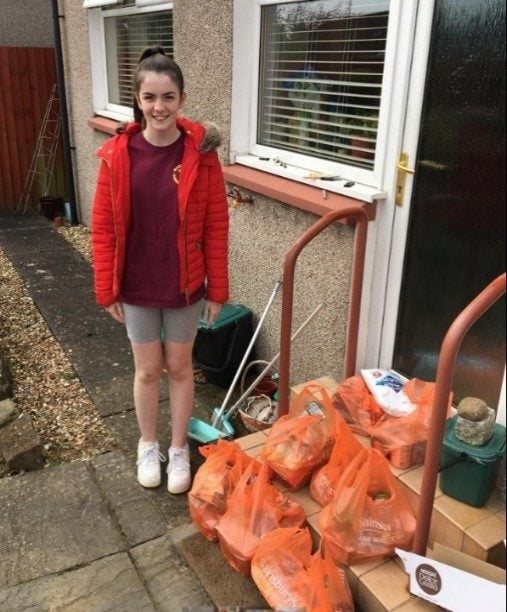 Poppy with bags of shopping