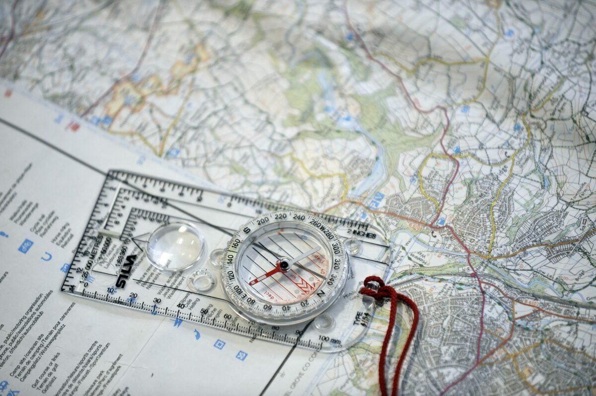 Close up photo of a compass on a map